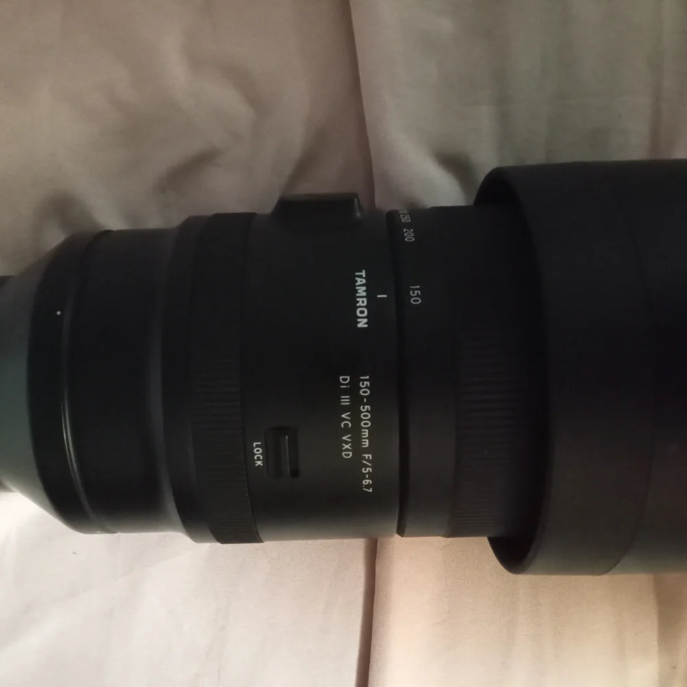 Black Telephoto Zoom Lens with Textured Focusing Ring and Robust Construction